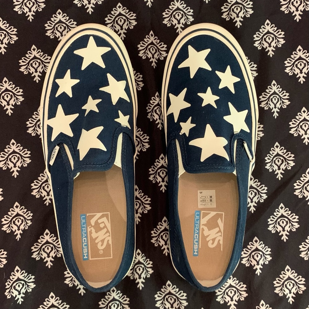 Vans slip-ons navy with white stars. Size 10 women’s or 8.5 in men’s.